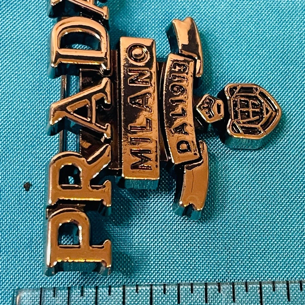 Prada Brooch Silver Logo Emblem Pin NIB